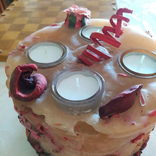 Decorative candle with dried flowers used