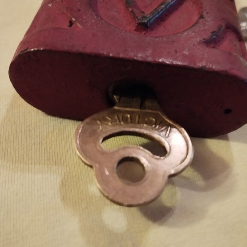 Old padlock used with key and skeleton key