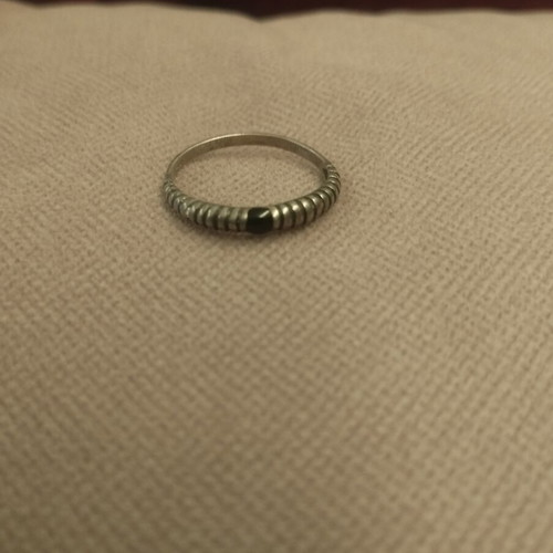 Silver ring with embossed ribbed design used