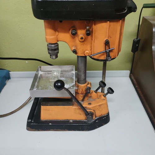Bench drill press used with water supply for stone drilling