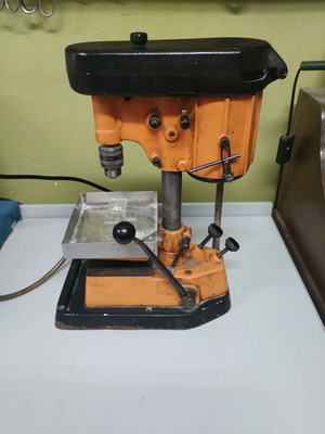 Bench drill press used with water supply for stone drilling