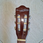 Classical guitar used with case, missing one string and small hole