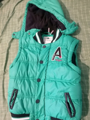 Sleeveless kids' puffer vest green like new with detachable hood