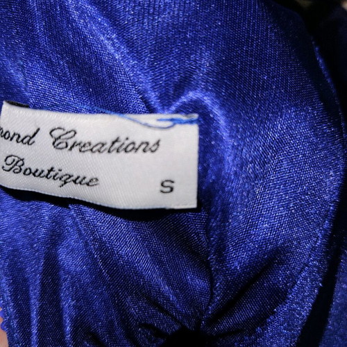 Diamond blue dress like new, open back with shoulder pads