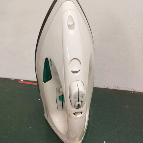 Handheld steam iron used