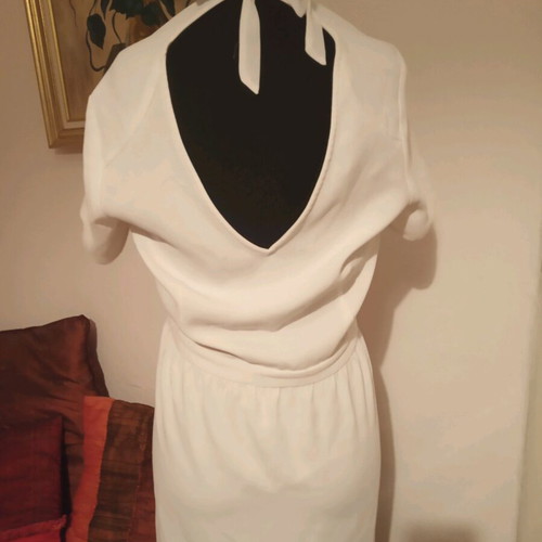Short-sleeve dress used, size M, with back opening and bow