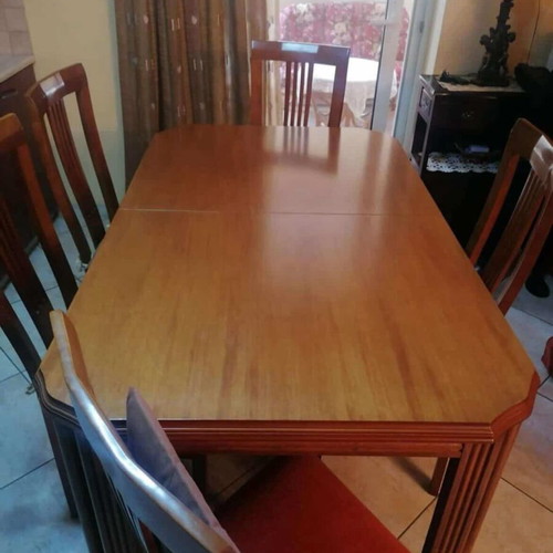 Wooden dining table with 6 chairs used, extends to 12 people