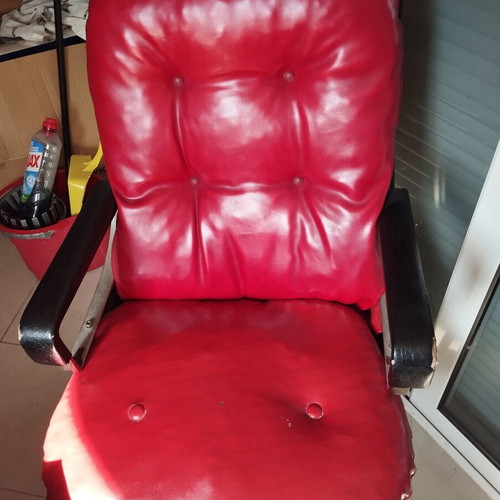 Office chair with genuine leather red used, armrest wear