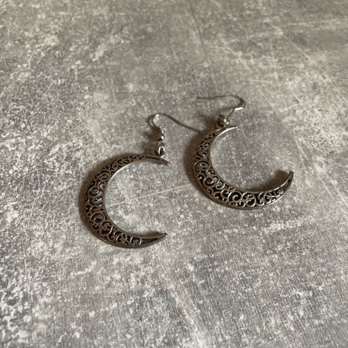 Dangling earrings used with silver crescent moons