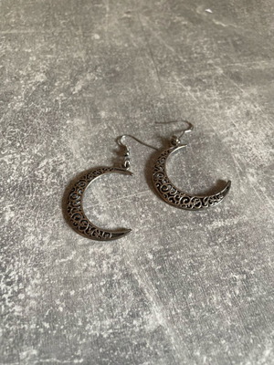 Dangling earrings used with silver crescent moons
