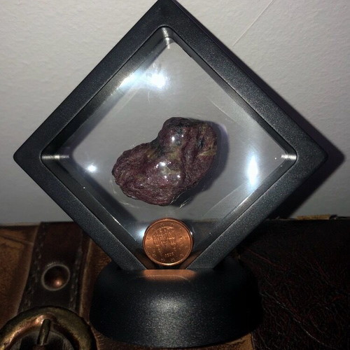 Raw large ruby 109ct in airtight display case