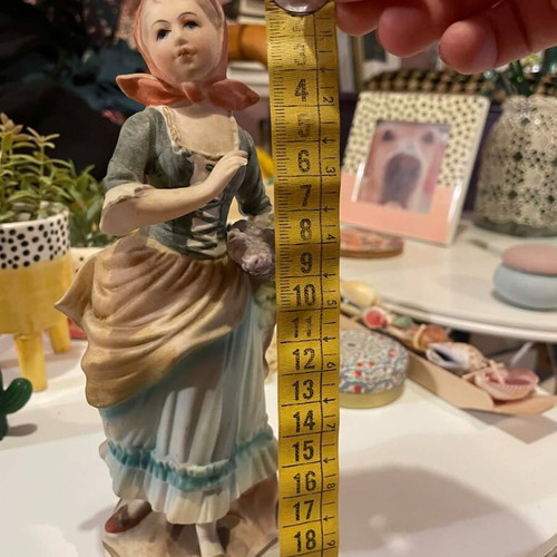 Porcelain decorative figurine of a girl with matte finish like new