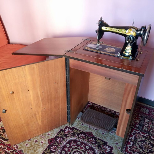 Mrsedes sewing machine used with antique furniture