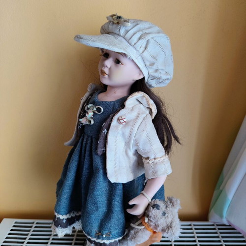 Porcelain doll with stand, 42 cm
