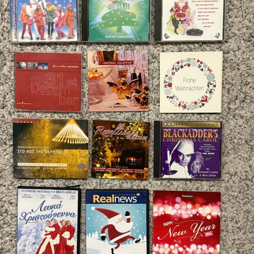 Large Christmas pack 12 CDs and DVDs like new with festive music and movies