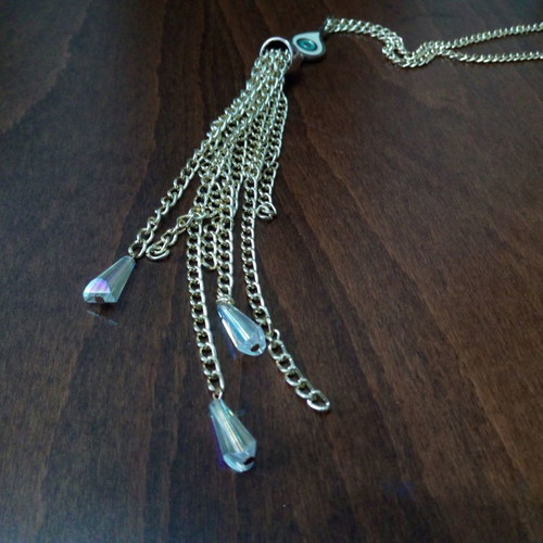 Enameled eye pendant used with gold chain and tassels