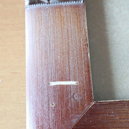 Brown photo frame used with small scratch