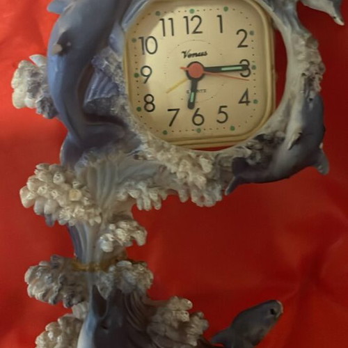 Clock used with dolphins around