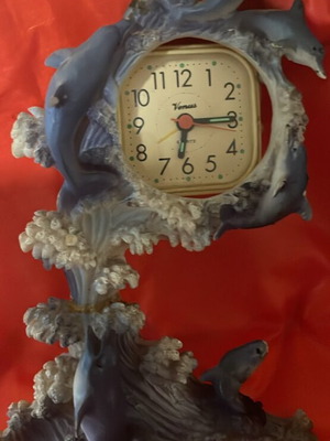 Clock used with dolphins around
