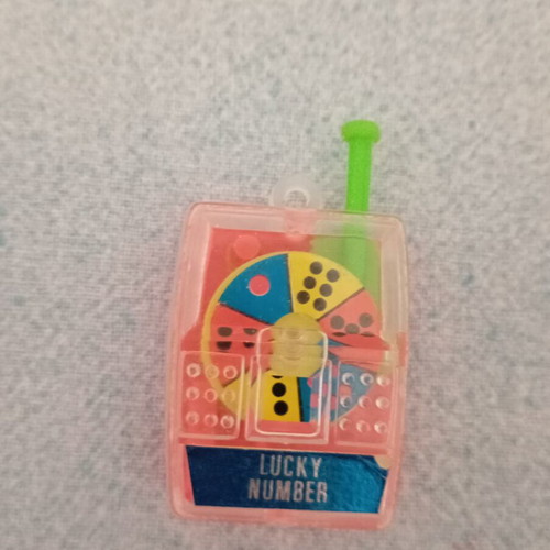 Vintage plastic Lucky Number toy