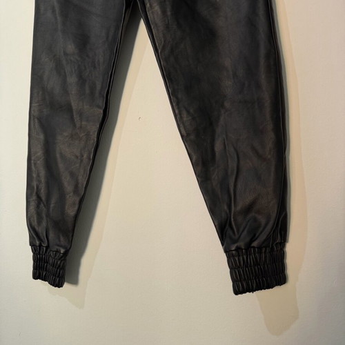 Women's black leather balloon or jogger pants used, with elastic waist and cuffs