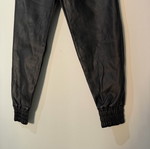 Women's black leather balloon or jogger pants used, with elastic waist and cuffs