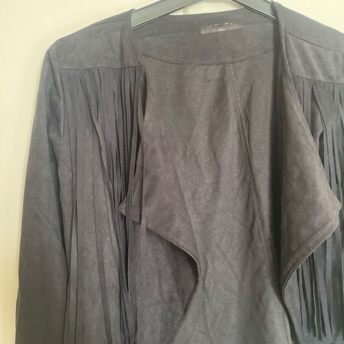 Women's short jacket used with fringes and castor texture