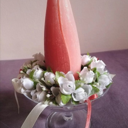 Glass candlestick with wreath and two-tone candle used