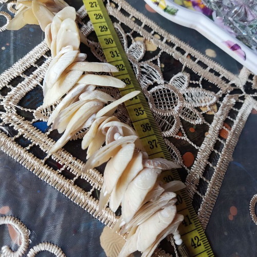 Vintage necklace made of natural shells in boho brutalist style, used