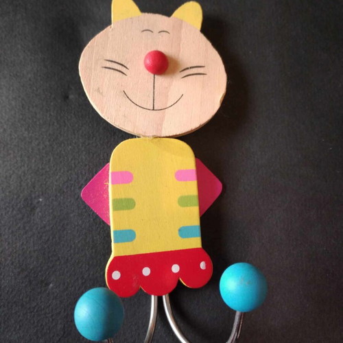 Children's wall hanger like new with metal base and wooden decorations