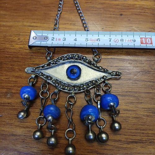 Vintage metal evil eye decoration used, silver with blue beads