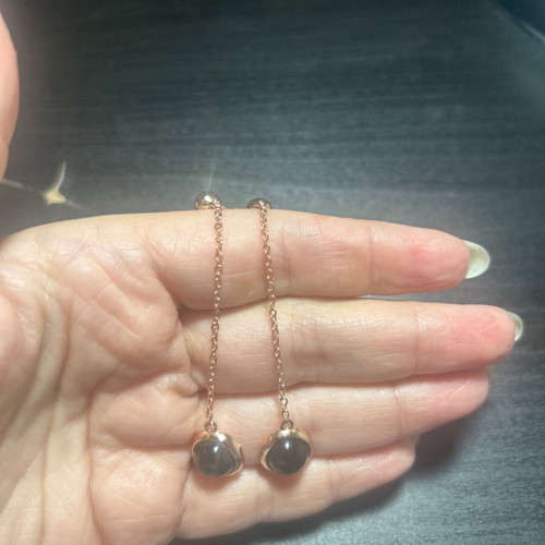 Dangling earrings, black and gold