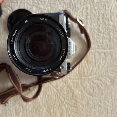 Nikon FM2 35 mm camera used with Telezon telephoto lens and lens cap
