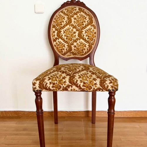 Chair used with wooden frame and brown velour fabric with floral pattern