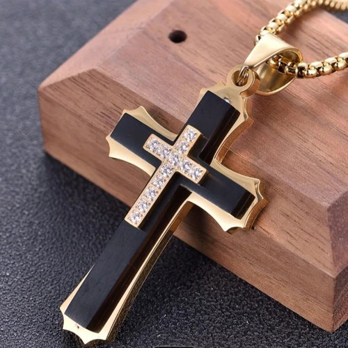 Elegant cross pendant with decorative stones and chain