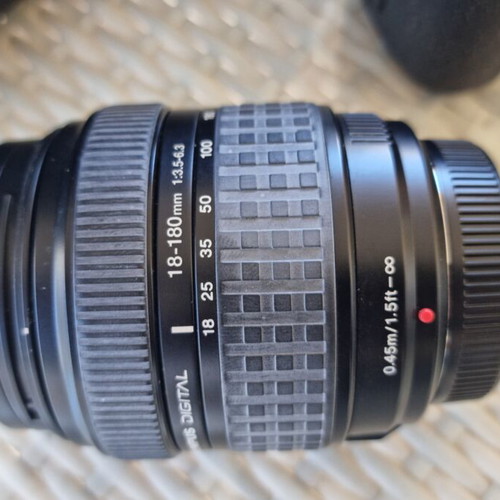 Olympus E-500 DSLR camera used with telephoto lens and case
