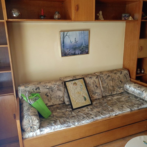 Sofa bed with pull-out double bed and bookshelf used