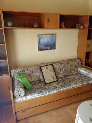 Sofa bed with pull-out double bed and bookshelf used
