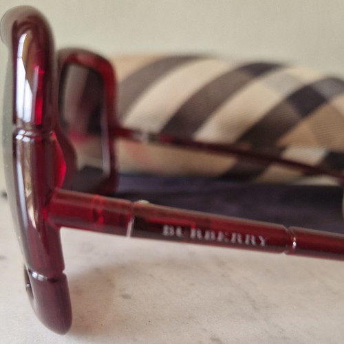 Burberry women's sunglasses used, burgundy with case