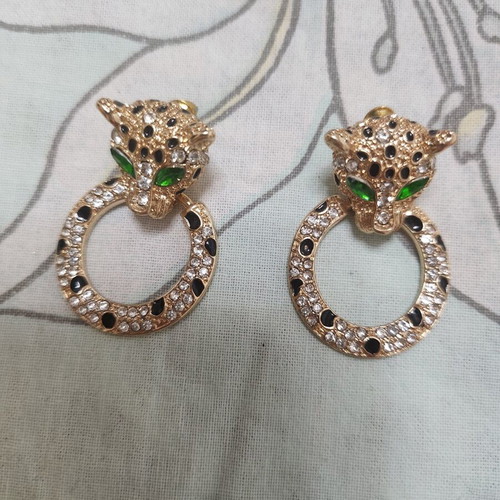 Gold-tone tiger earrings and necklace set with rhinestones