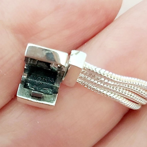 Pandora s925Ale Reflexions bracelet with four strands.