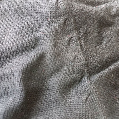 Fitted black pullover like new, long with buttons on sleeves