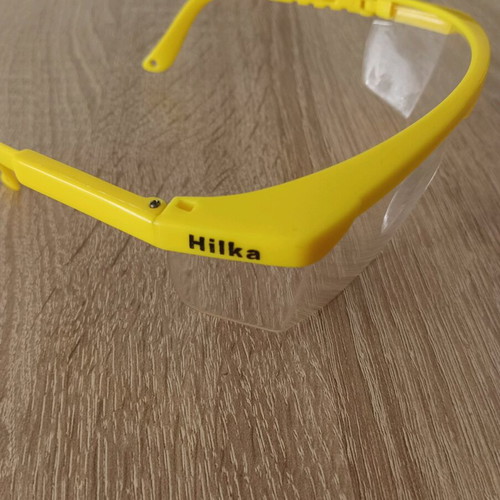 Hilka safety glasses used with adjustment and cord holes