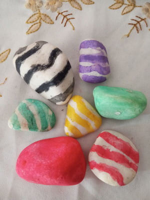 Painted stones used, set of colorful rocks