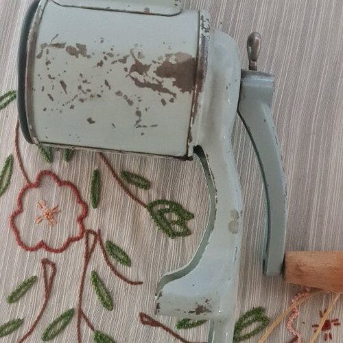 Vintage cheese grater used, table clamp