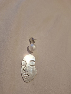 Handmade face earring silver used
