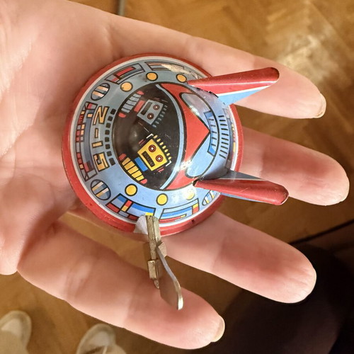 Vintage tin toy UFO with wind-up mechanism used