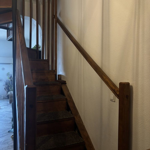 Wooden indoor staircase used with storage