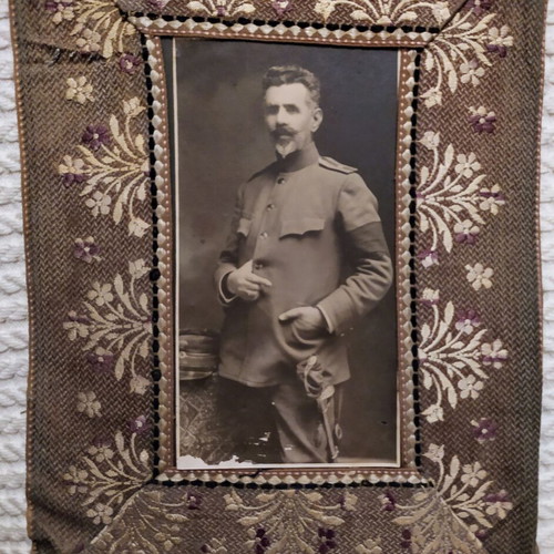 Old military photograph on embroidered frame used
