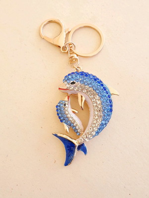 Dolphin bag charm keychain like new with white and blue rhinestones